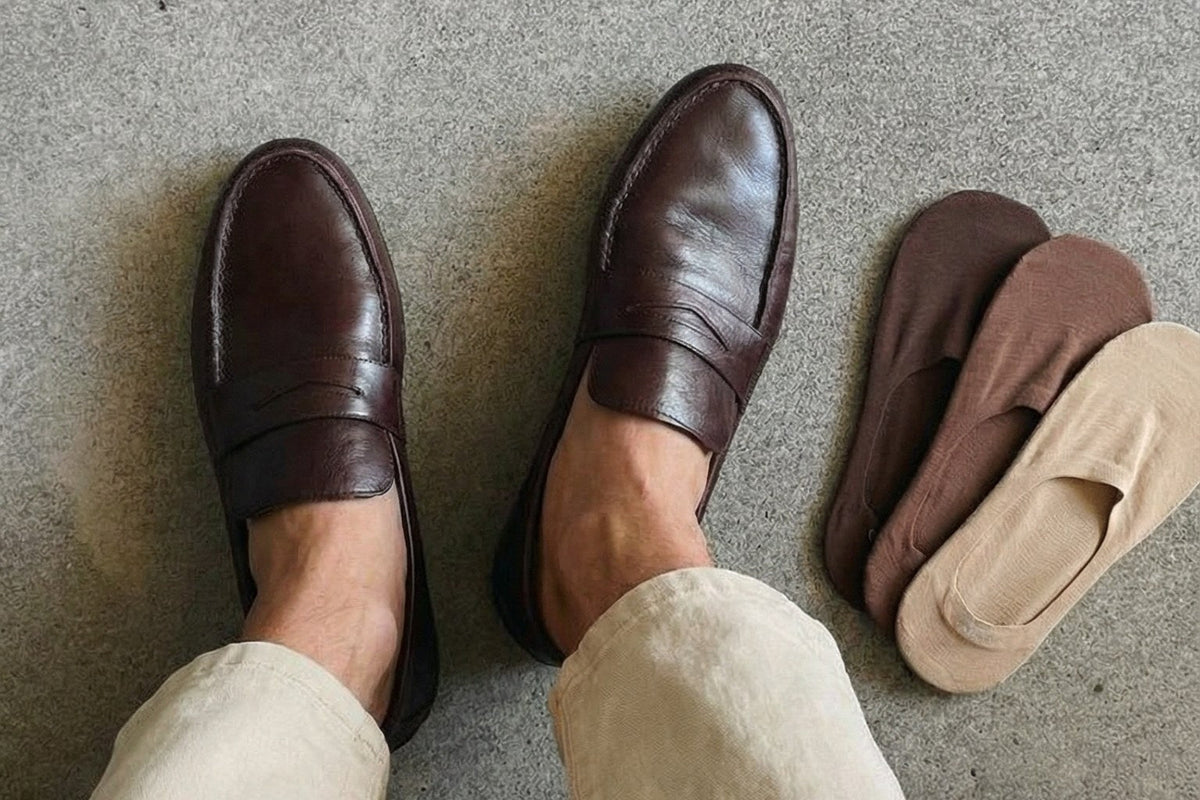 Brown leather penny loafers worn with cropped trousers and Undercurrent Mid-Cut no show socks in Espresso Brown, Toffee Tan and Almond Beige
