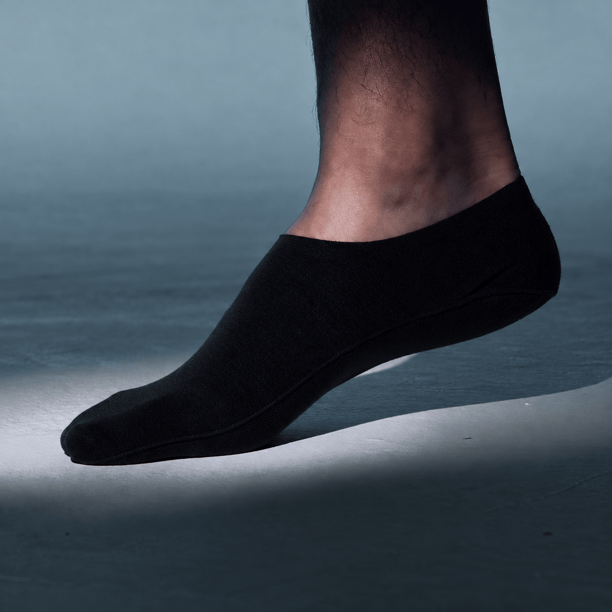 Undercurrent high cut no show sock in black, covering more of the top of the foot