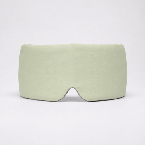 Deep Rest Sleep Mask in Honeydew Green, front view, showing the contoured nose bridge